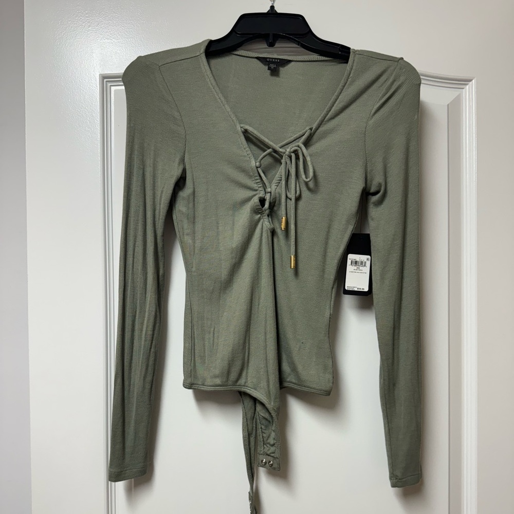 . Comfortable and stretchy brand new guess bodysuit  xs